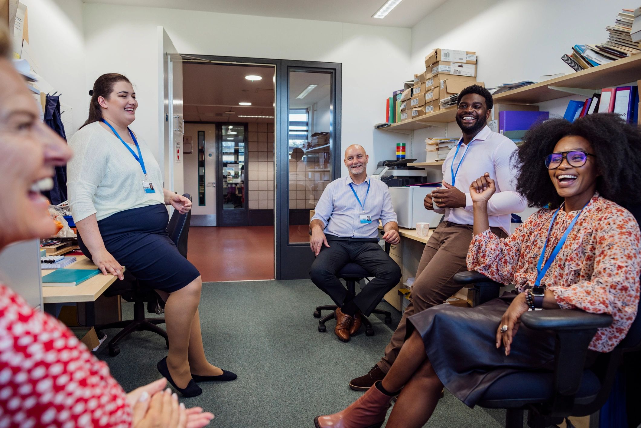 Teachers and school staff sharing a light moment together