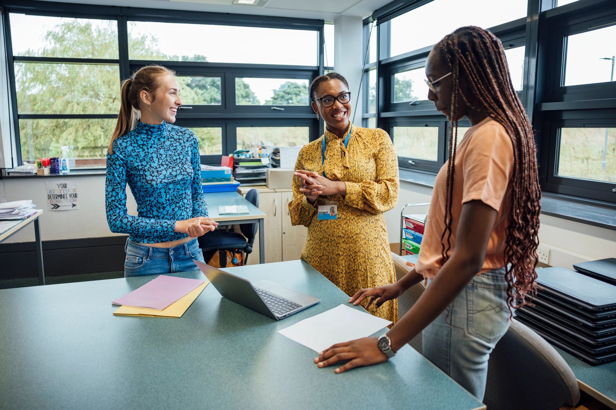 Teacher supporting students in a classroom discussion