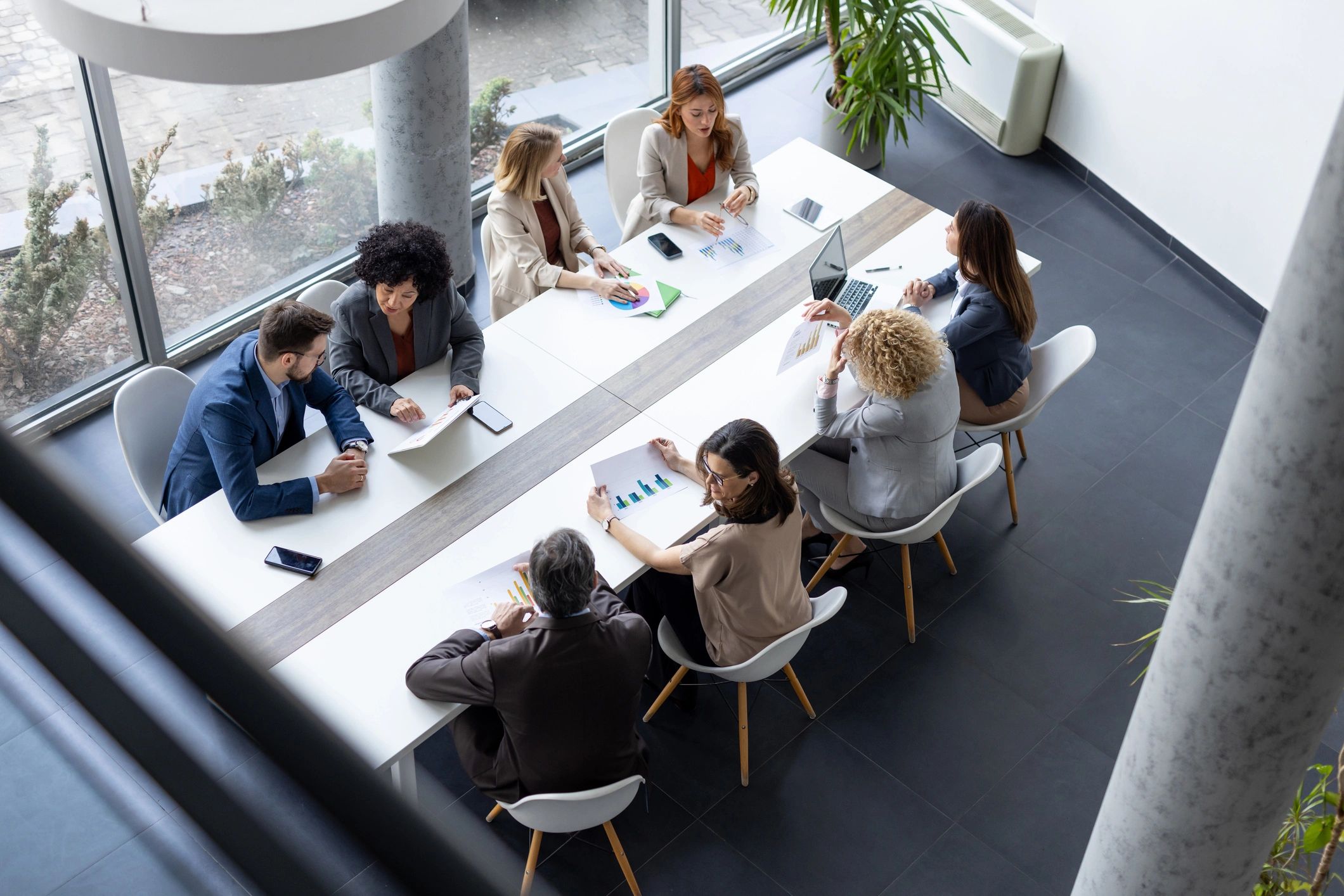 School leaders in discussion around a conference table