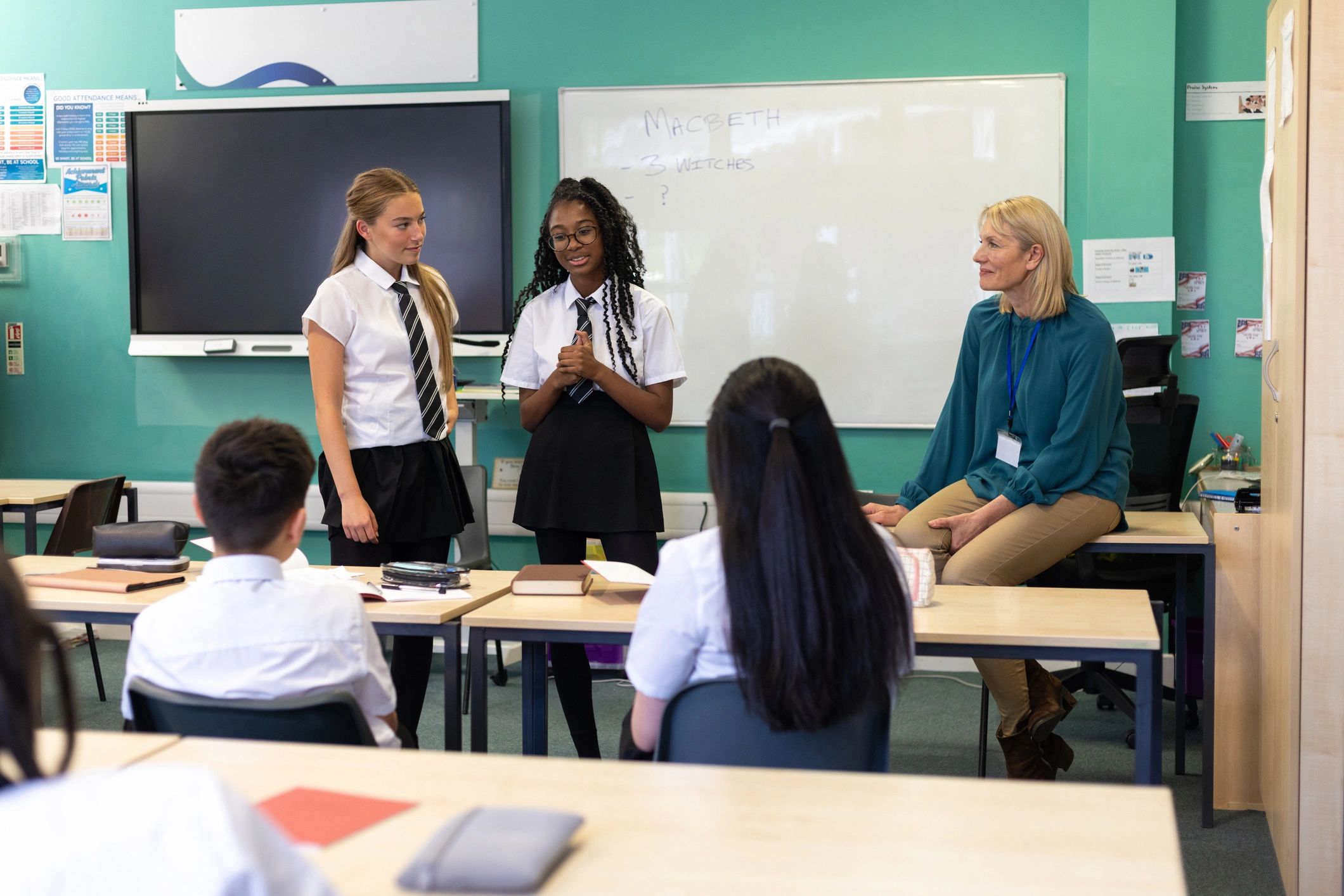 Students presenting in front of their class