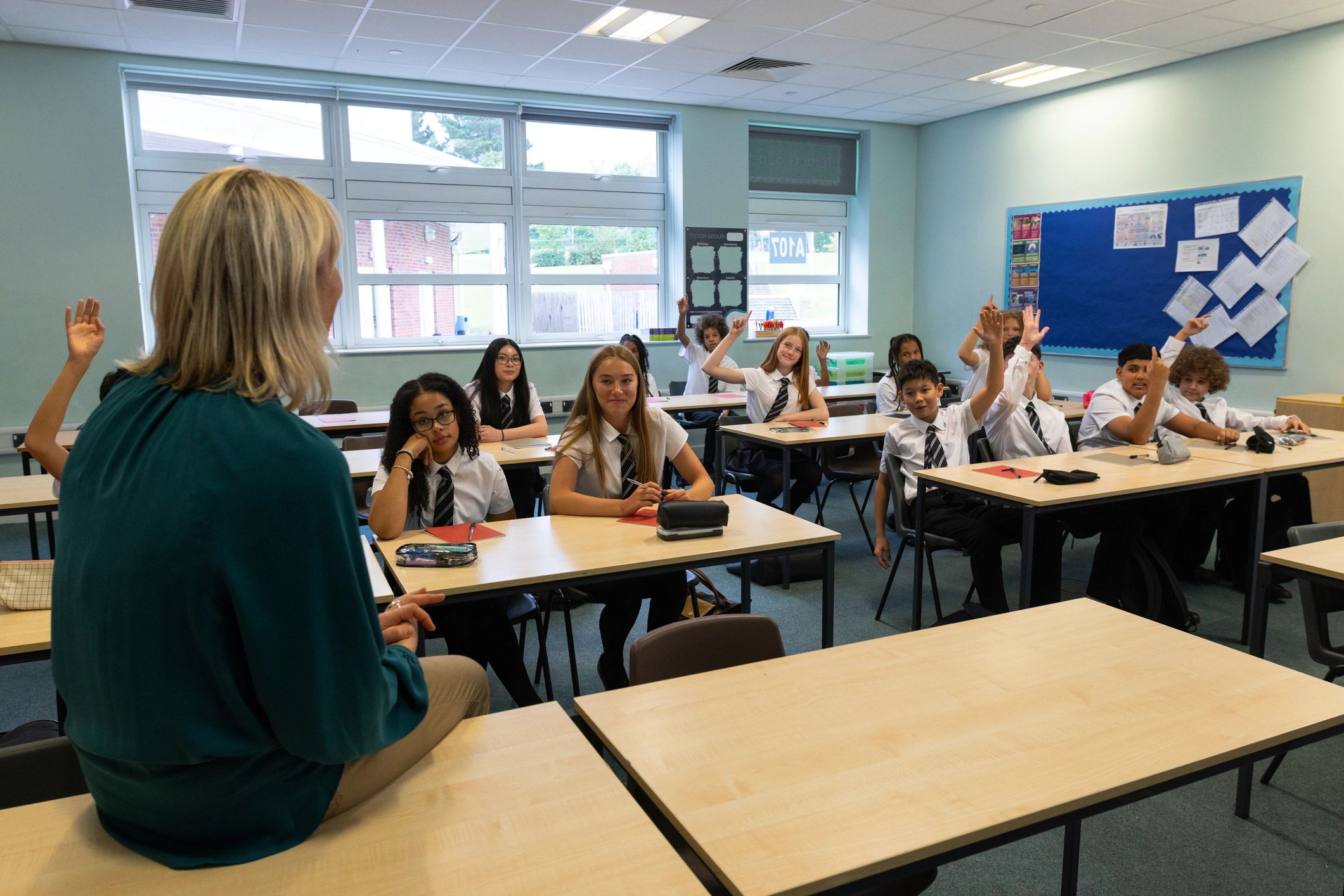 Teacher conducting class with students